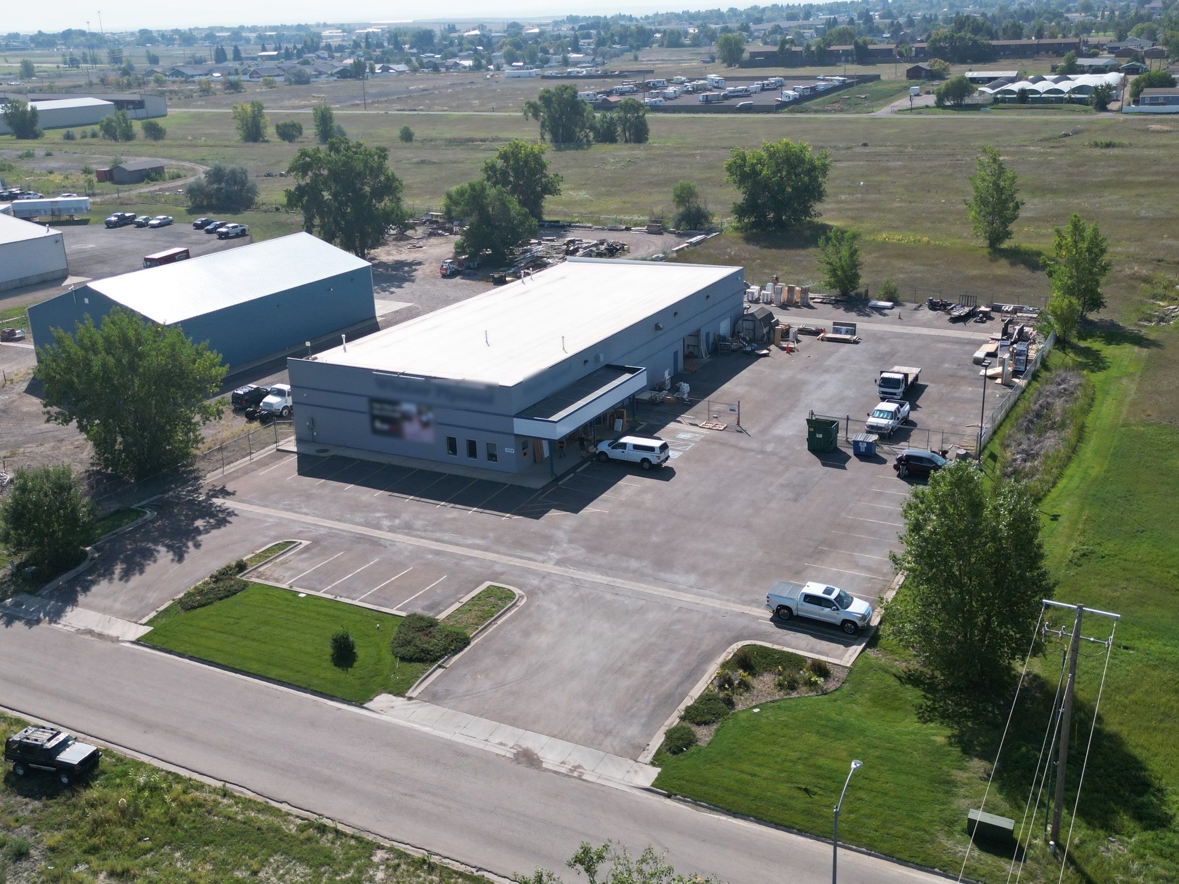 Aerial view of a Great Falls warehouse with a paved yard